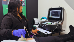 Healthcare professional performing bone density scan using ultrasound imaging equipment to assess osteoporosis risk and bone health.